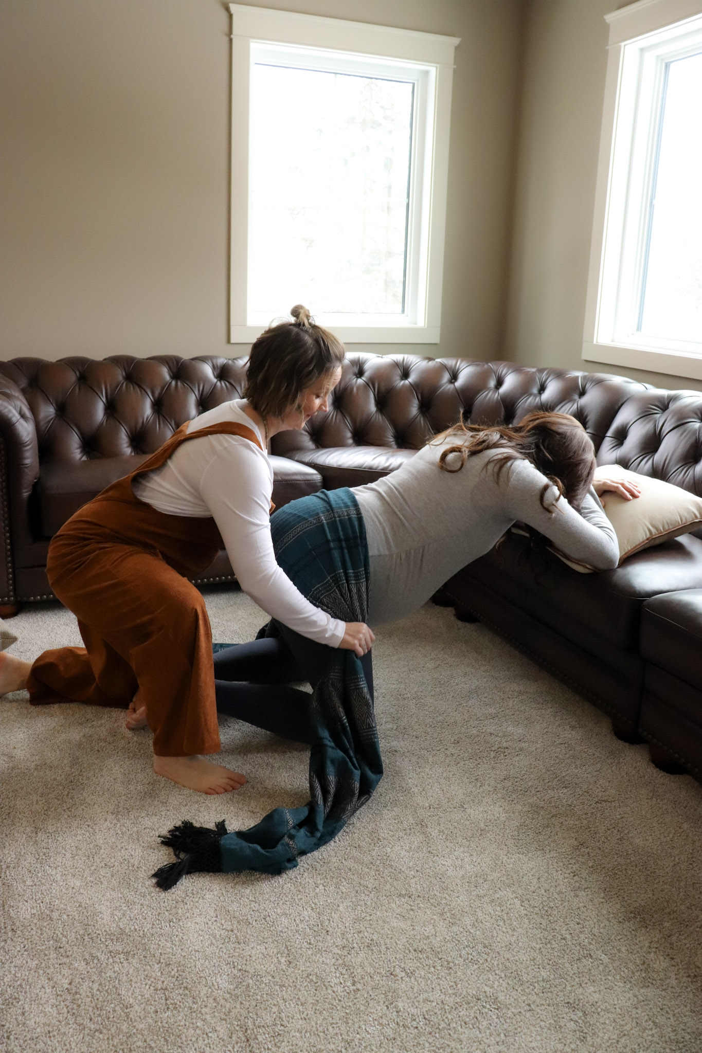 Andria providing hands-on labour support with a bolster